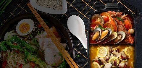 Multifunction Cooking Pot with HotPot with 2 separate sections for the seafood dish and chicken dish